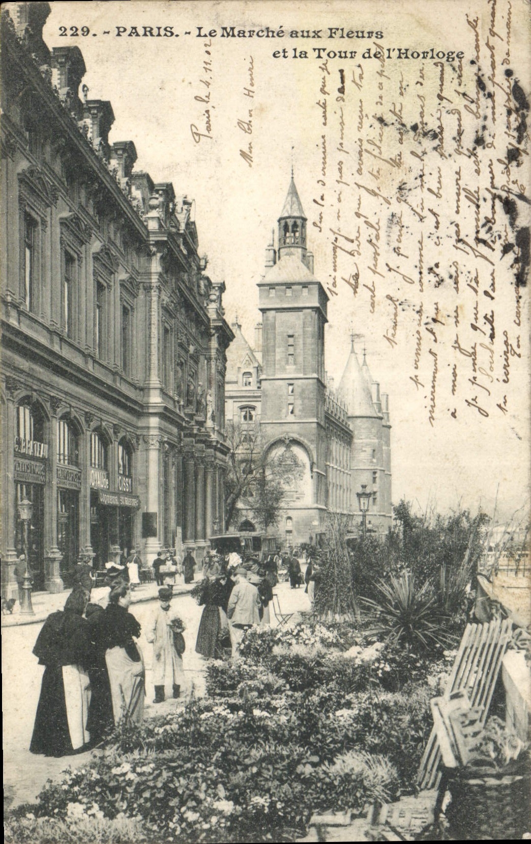 CPA Paris le Marche aux Fleurs et la Tour de l'Horloge