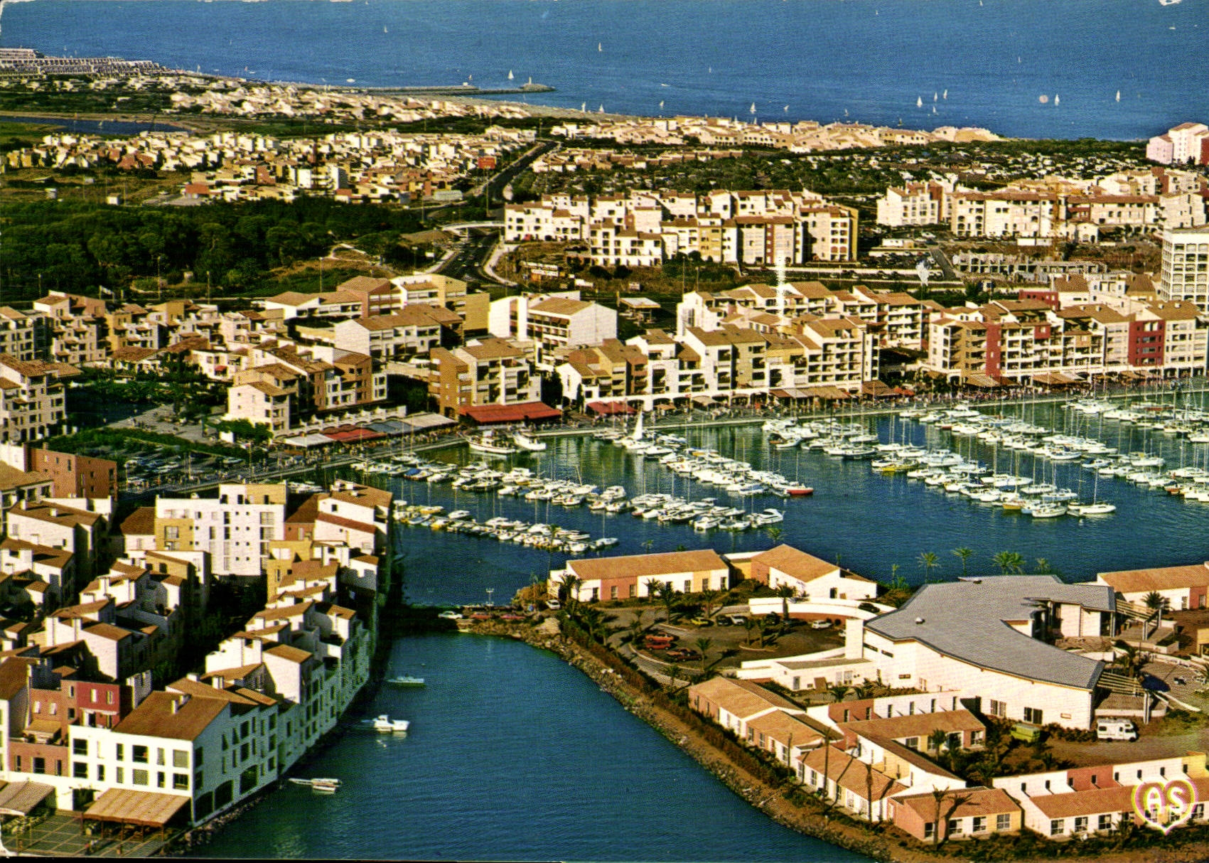 CPM En Parcourant la Cote Mediterraneene Agde et ses Plages Herault le Cap d'Agde vue aerienne 