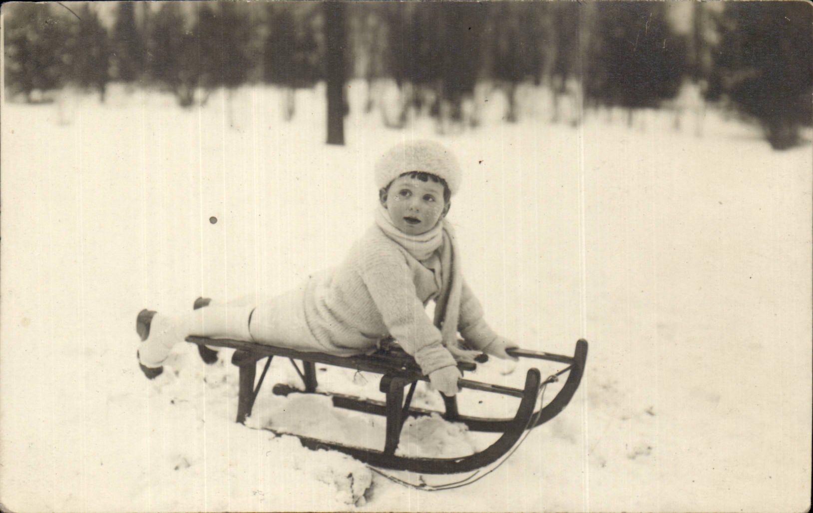 Real photo Child and toboggan (winter sports)