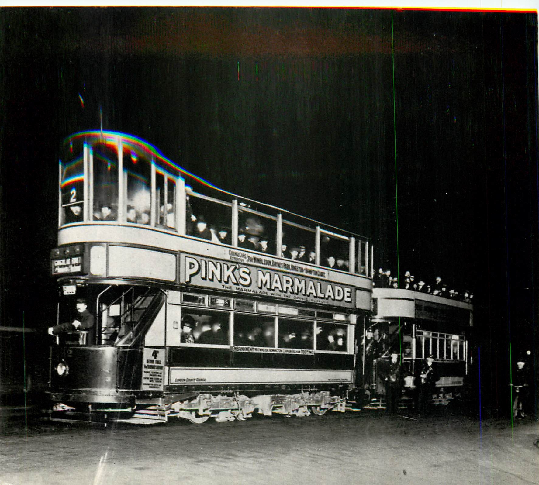CPM London transport at night class tram with traller car