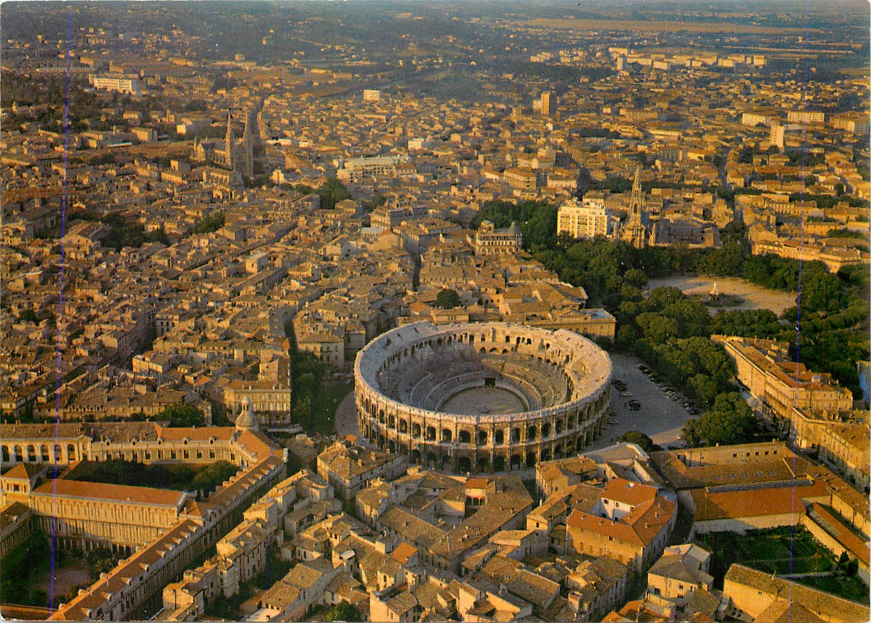CPM Nimes Gard Vue generale de la ville par avion au centre les arenes 