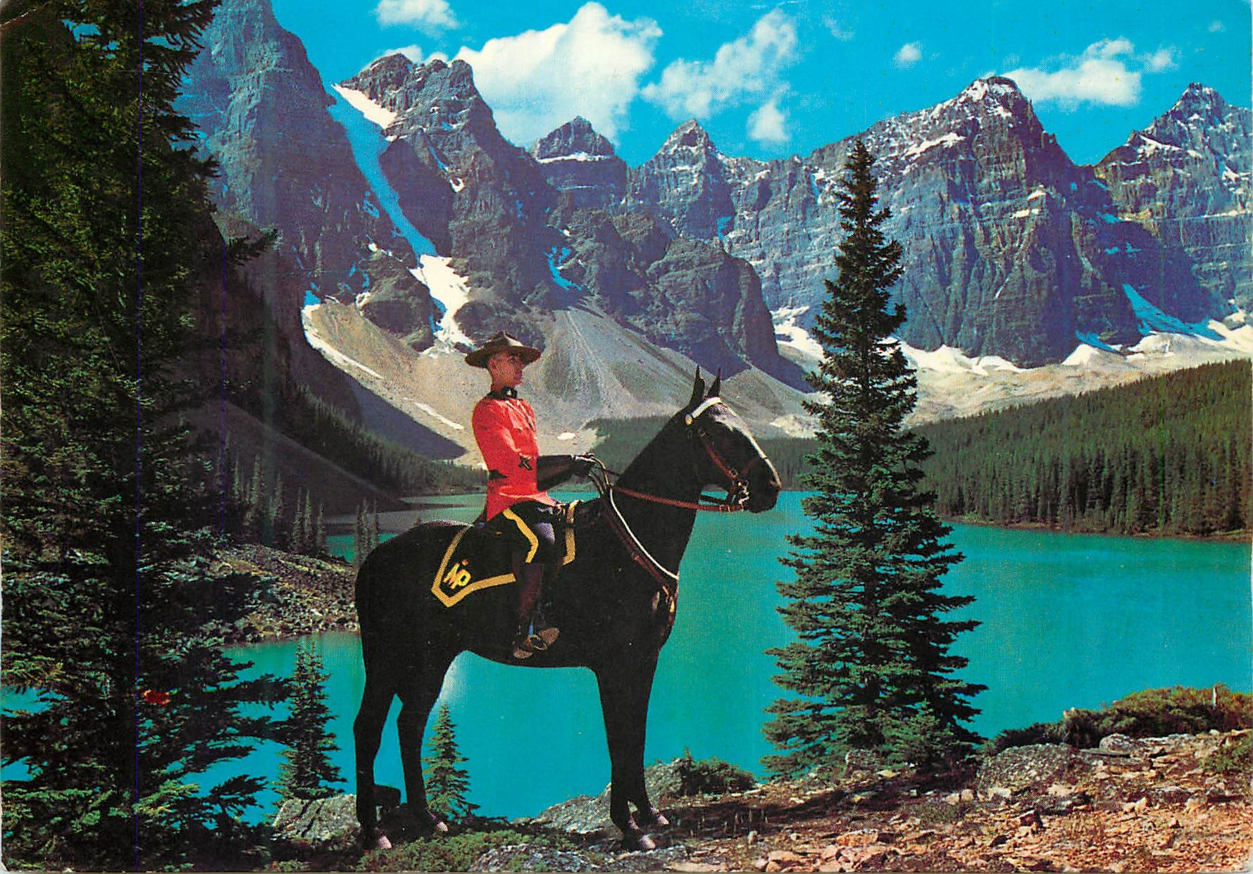 CPM A member of the famous Royal Canadian Mounted Police set against a majestic mountain background