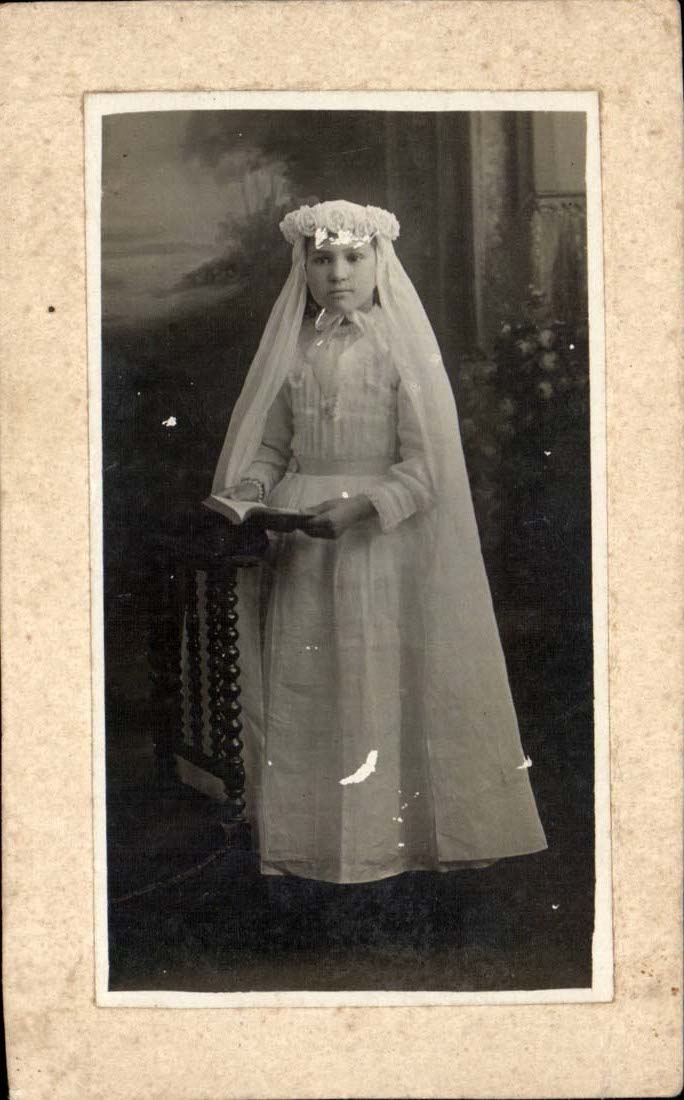 Real photo girl as a communicant