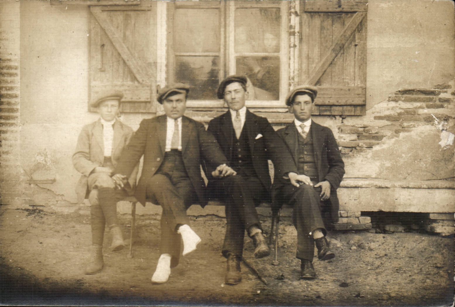 Real photo Men on a bench (folklore costume caps)