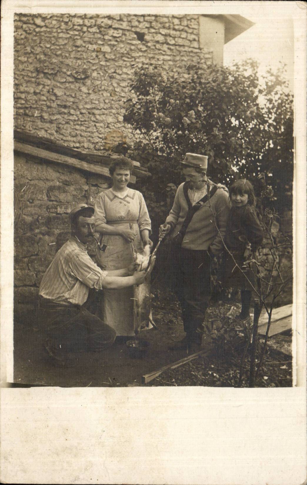 Real photo Militaria Soldier cutting out a rabbit