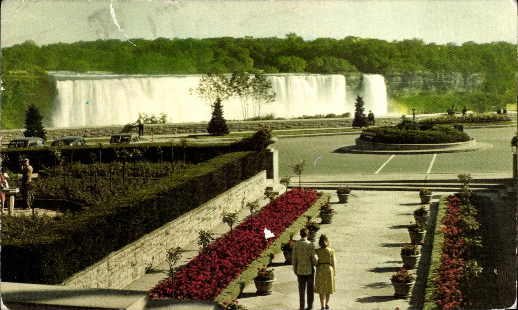 CPA el americano baja as visto de los jardines de flor coloridos uno el lado del canadia de Niagara Falls