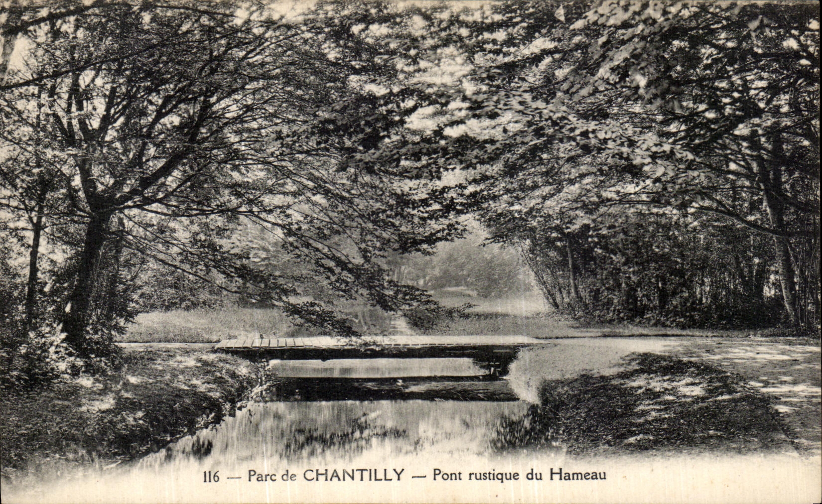VINTAGE POSTCARD Park of rustic Chantilly Bridge of the Hamlet