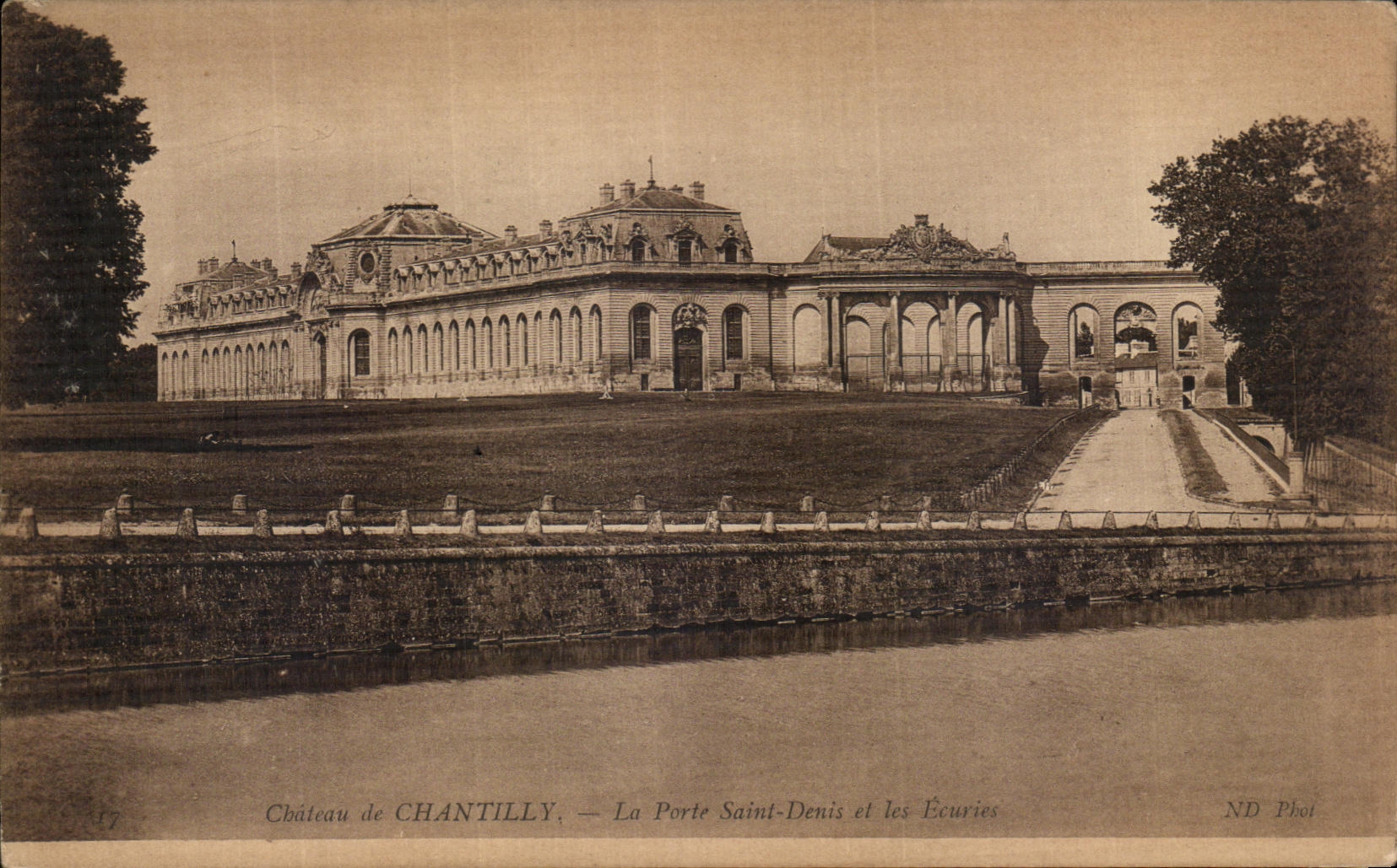 VINTAGE POSTCARD Castle of Chantilly the door Holy Denis and stables