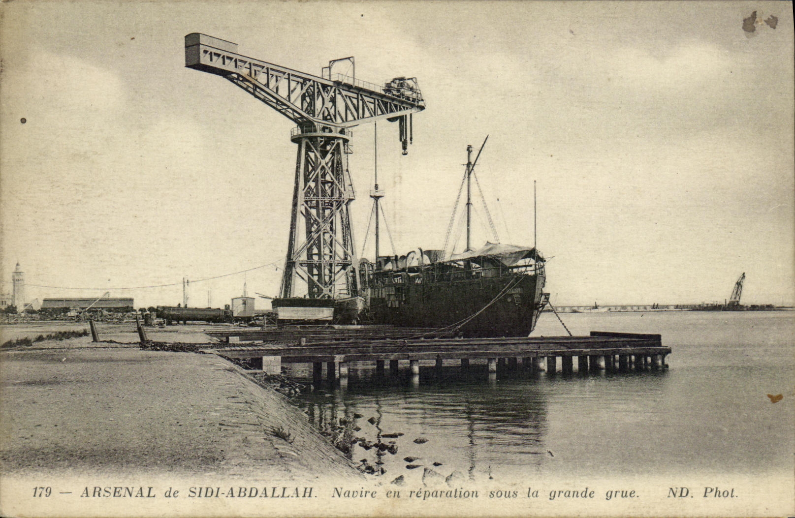 VINTAGE POSTCARD Boat War Arsenal of Sidi Abdallah Ship in repair under the large crane