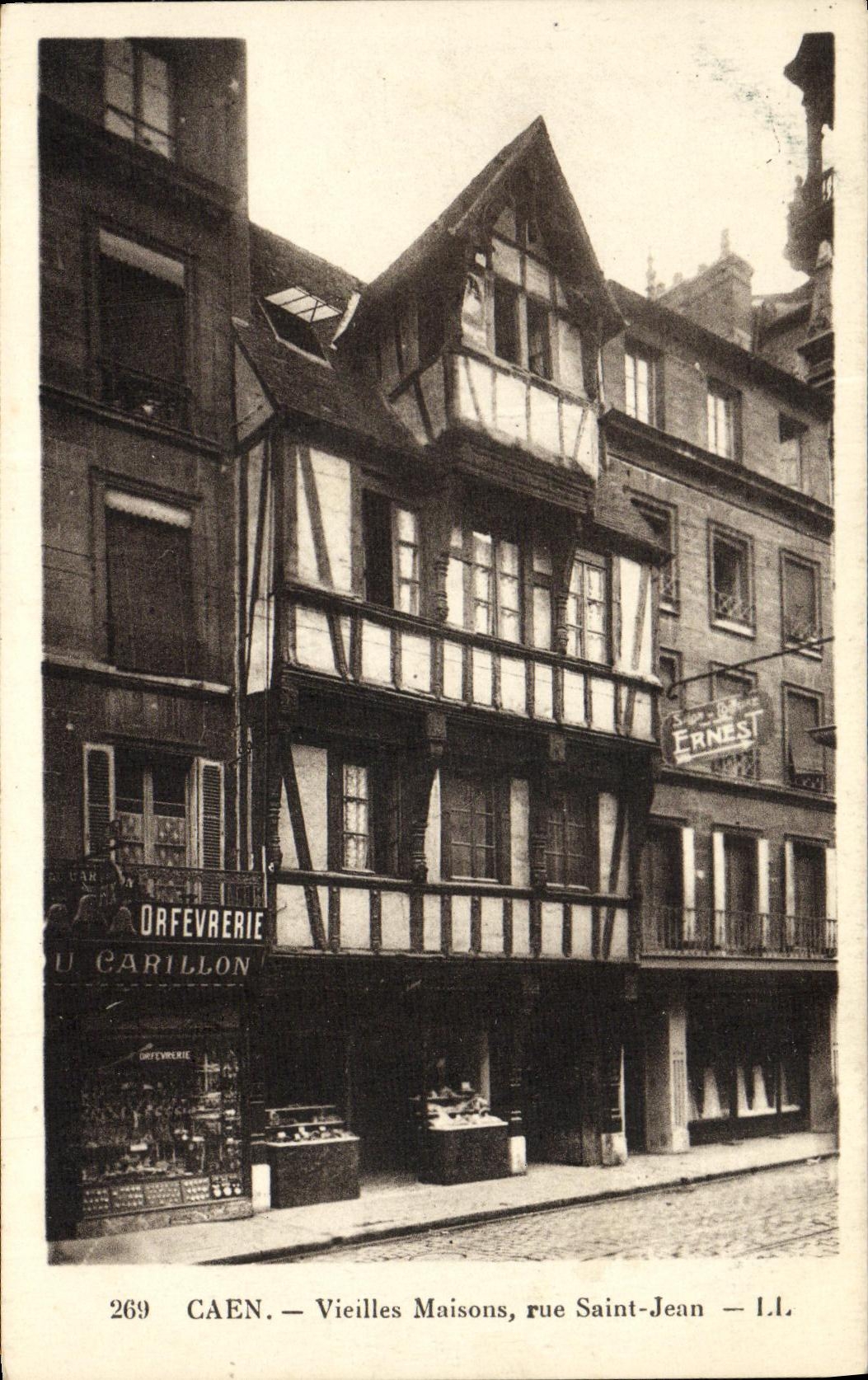 VINTAGE POSTCARD Caen Old woman Houses Street Saint Jean Goldsmithery Chime