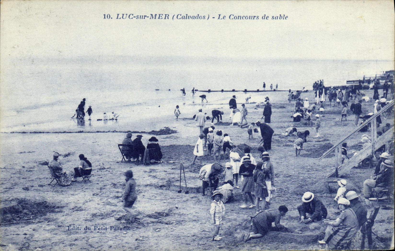 POSTAL Lucas de la VENDIMIA en el mar la competencia de la arena