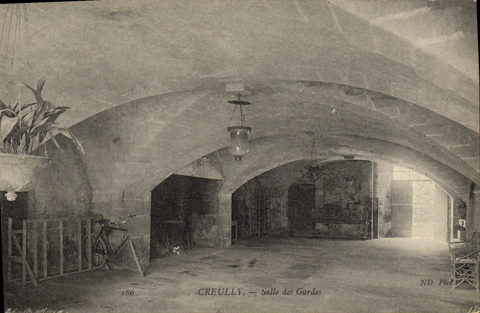 VINTAGE POSTCARD Creully Room of the Guards Bicycle
