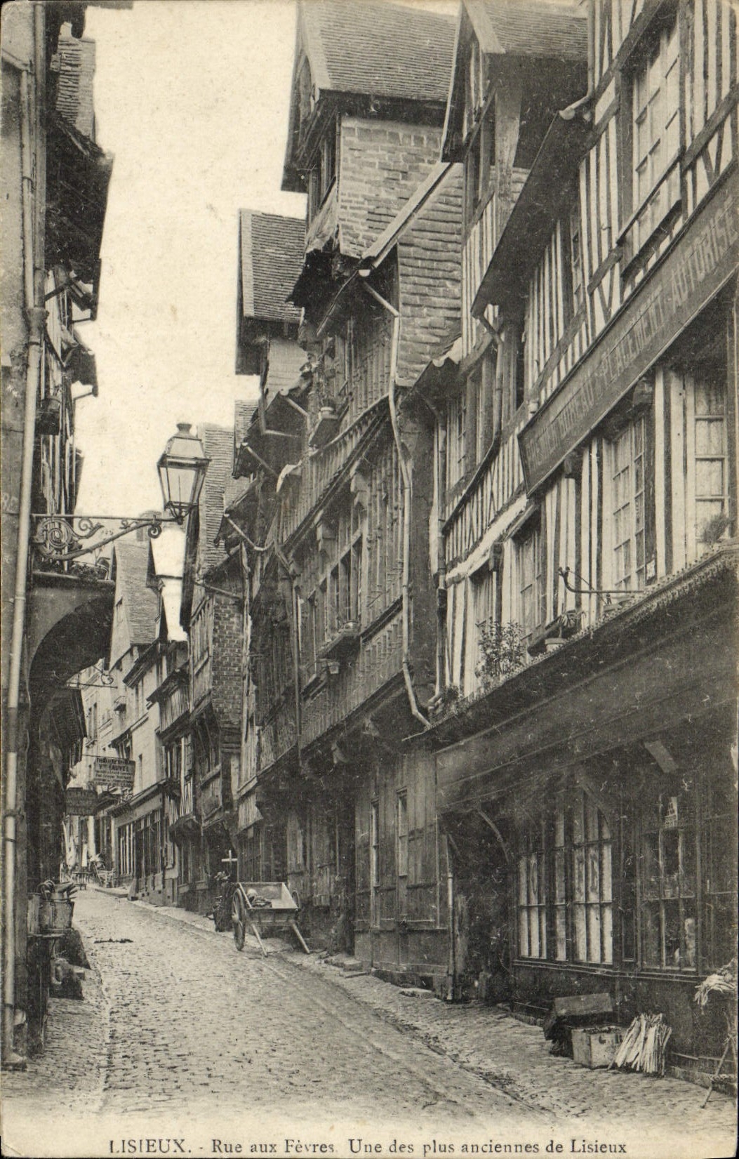VINTAGE POSTCARD Lisieux Street with the Boilermen One of oldest of Lisieux