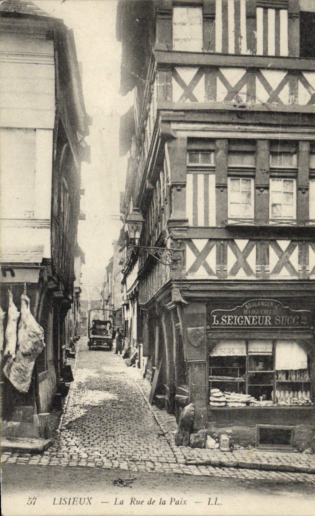 VINTAGE POSTCARD Lisieux the Street of Peace Butchery