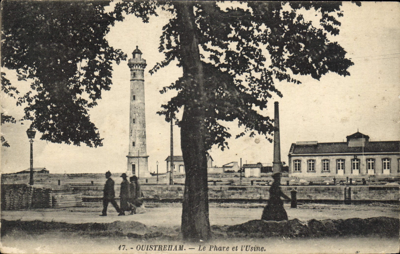 VINTAGE POSTCARD Oustreham the headlight and the factory