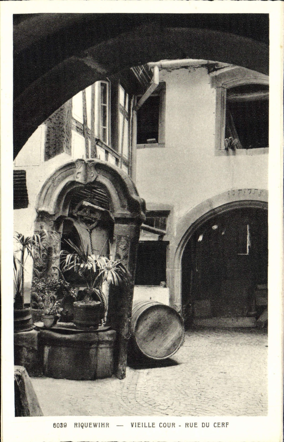 VINTAGE POSTCARD Riquewihr Old woman Court Street of the Stag