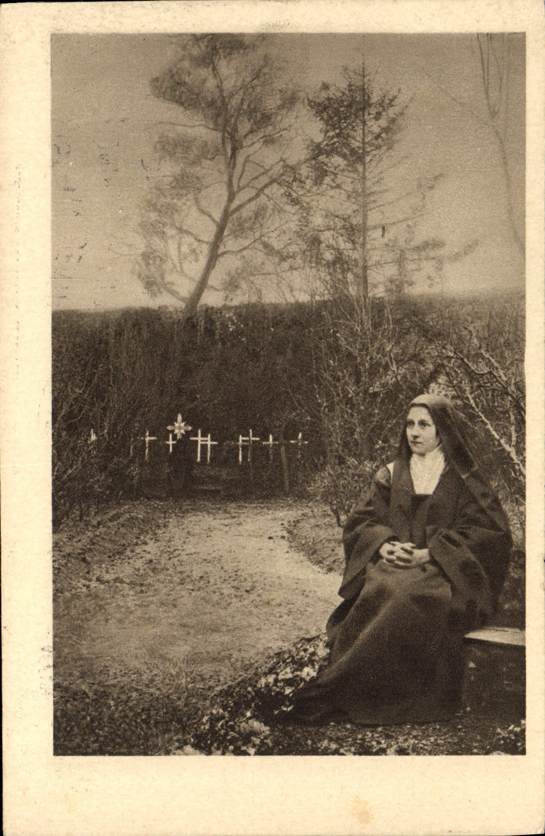 VINTAGE POSTCARD Lisieux co. Therese of the Jesus child sitting in the garden of the carmel
