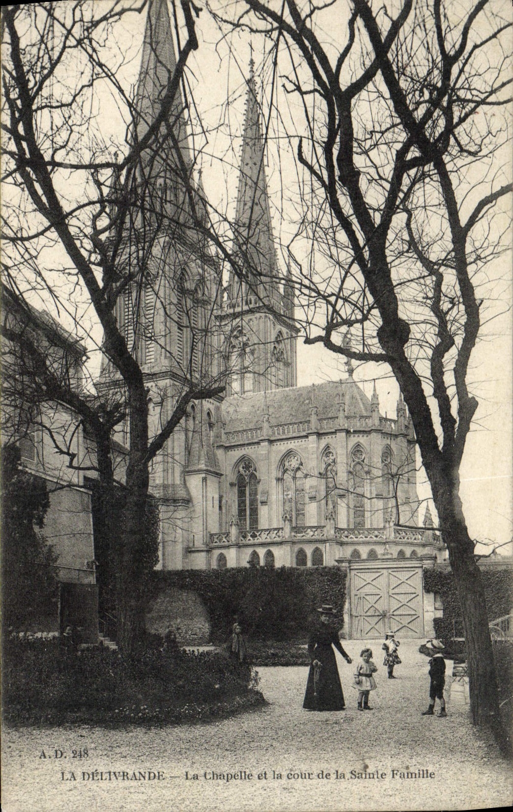 VINTAGE POSTCARD Delivrande La Chapelle and Court Of the Holy Family Woman Children
