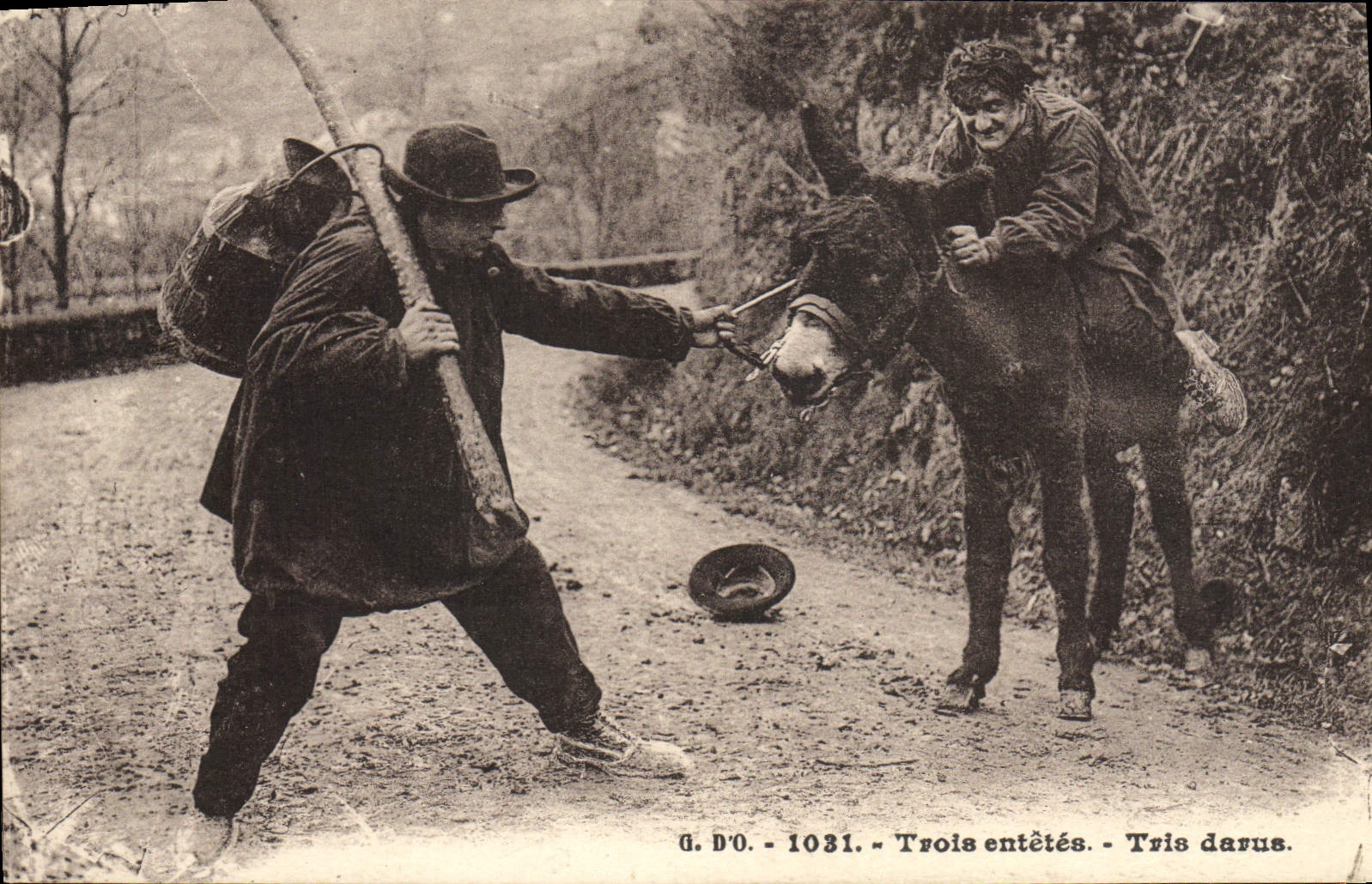 Títulos de la POSTAL tres de la VENDIMIA que clasifican el asno de Darus