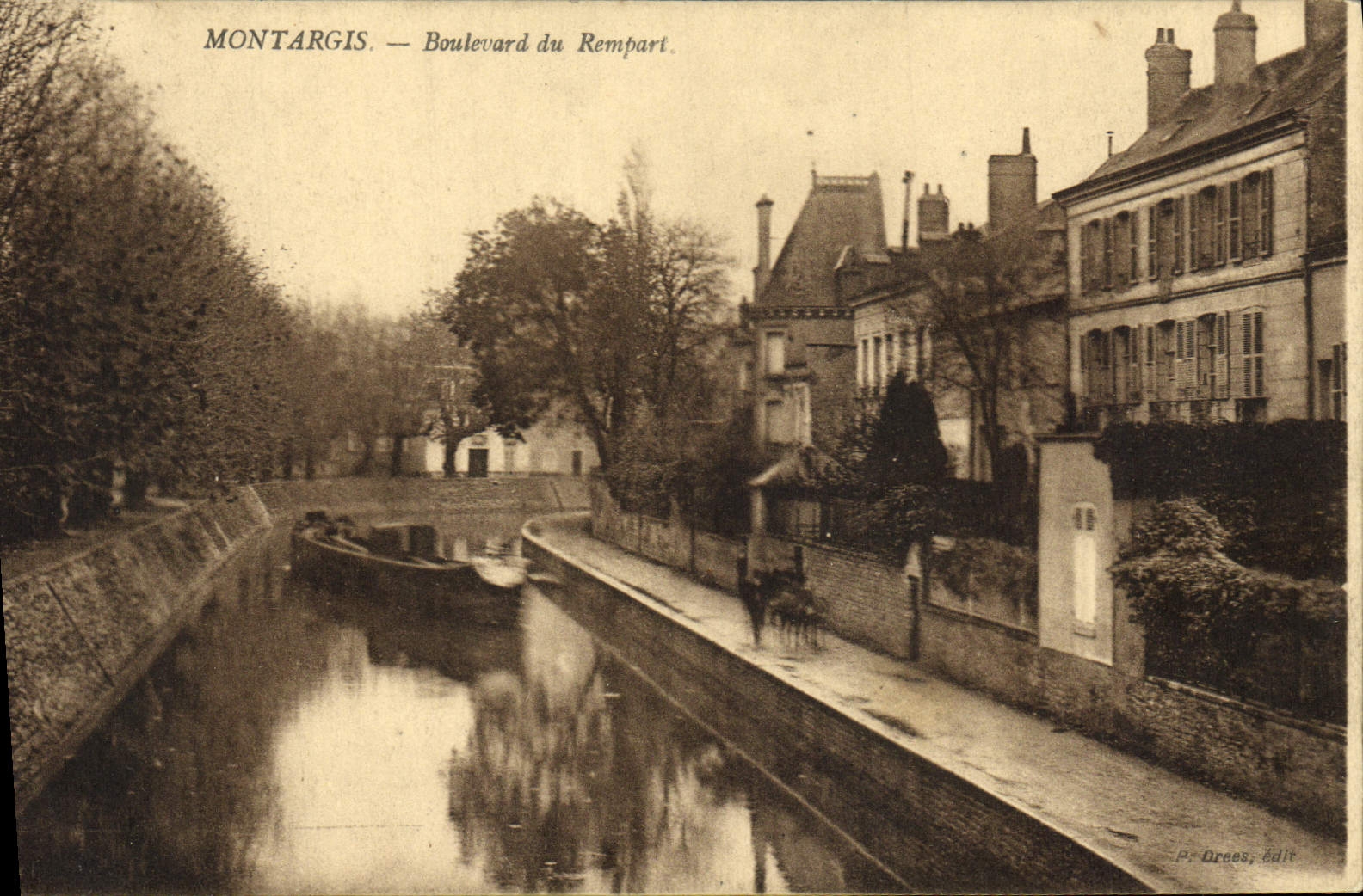 VINTAGE POSTCARD Montargis Boulevard Of the Rampart Boat