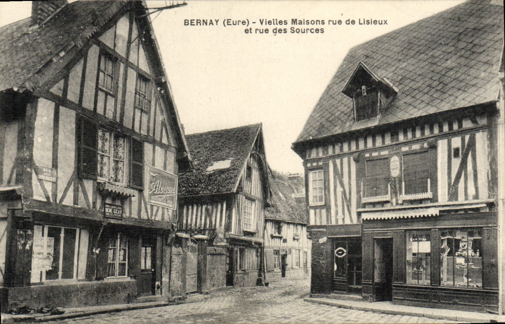 VINTAGE POSTCARD Bernay Hurdy-gurdies Houses street De Lisieux and street of the sources