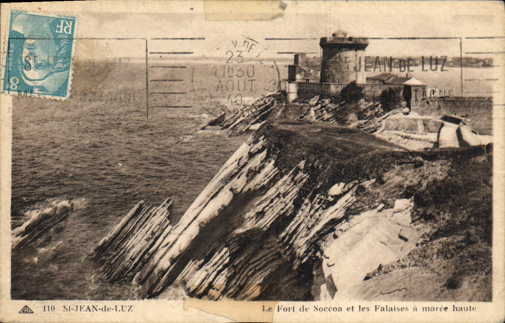 VINTAGE POSTCARD Holy Jean De Luz the Fort of Soccoa and the Cliffs has high tide