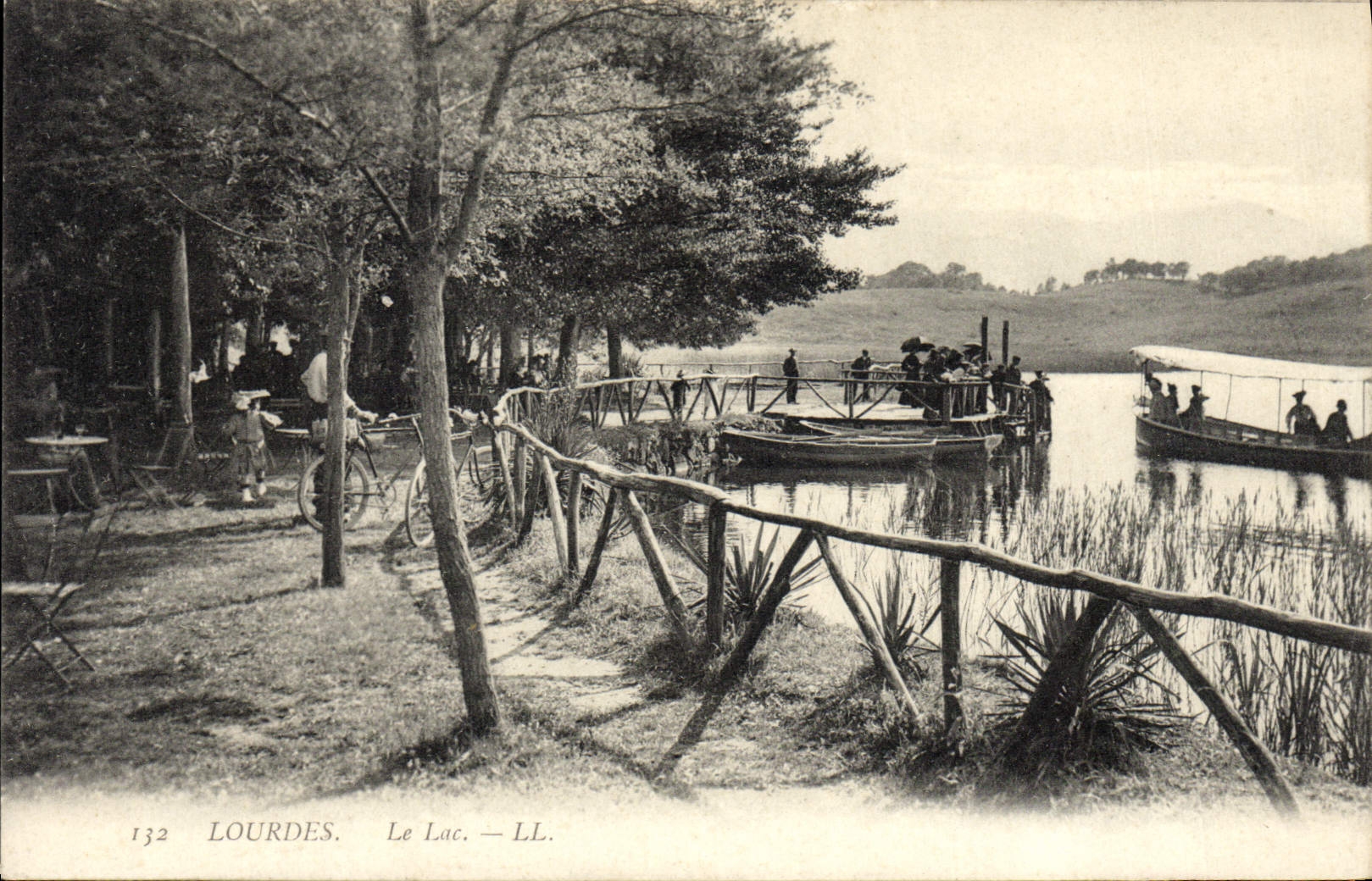 VINTAGE POSTCARD Heavy the Lake Boat Bicycle