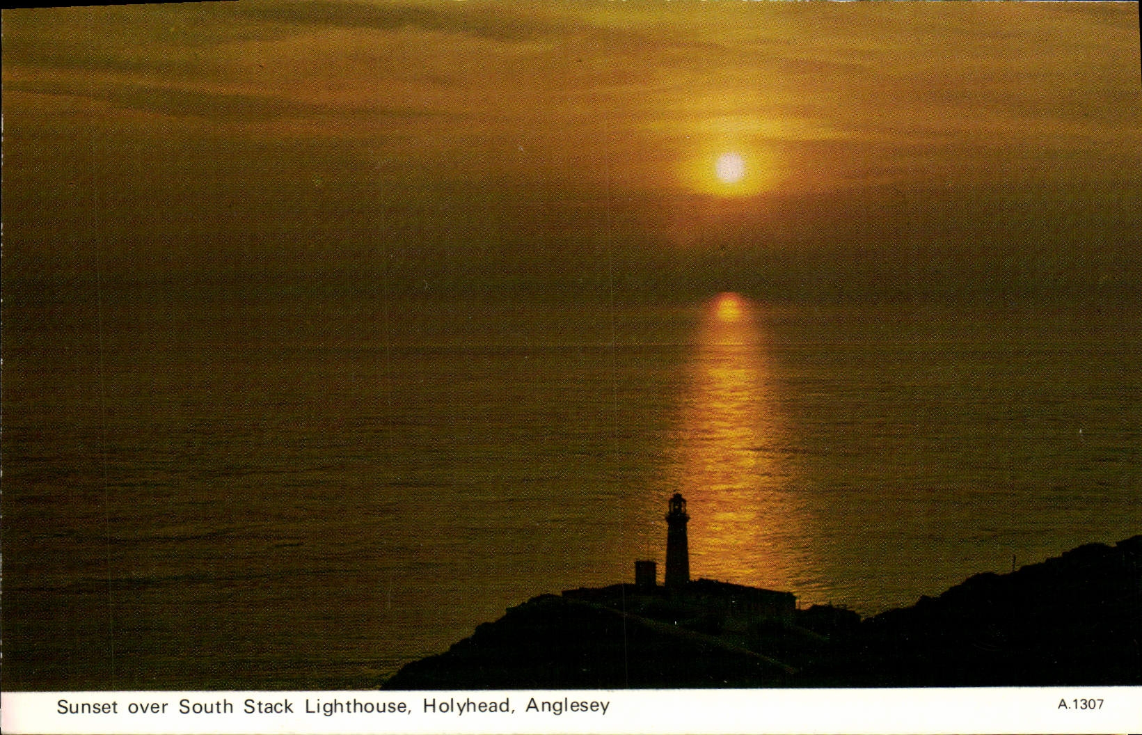 MODERN CARD Sunset over South Stack Lighthouse Holyhead Angelsey
