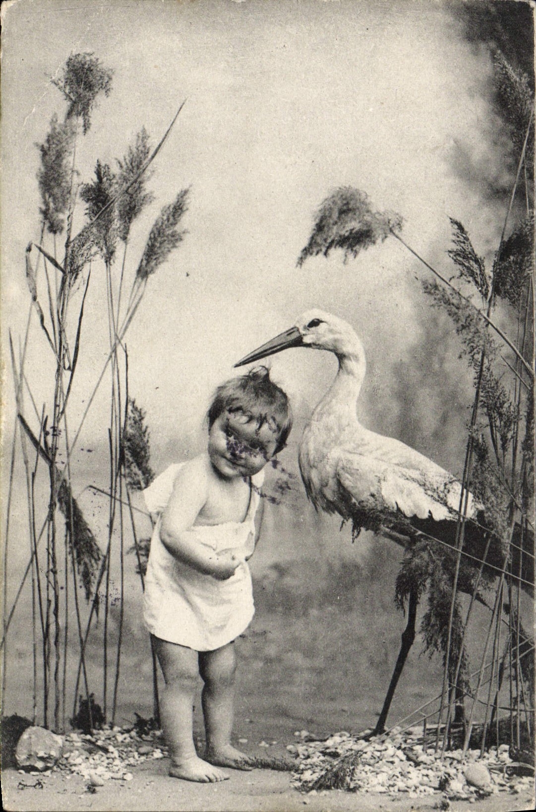 CPA Fantaisie Enfant Cigogne