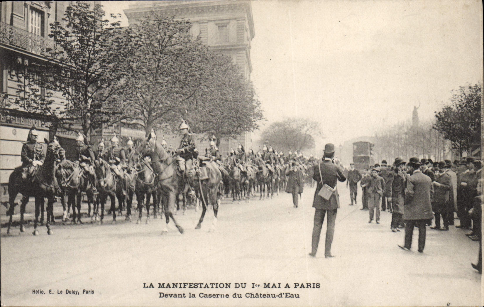 VINTAGE POSTCARD the manifestation of May 1st has Paris In front of the barracks of the water Tower