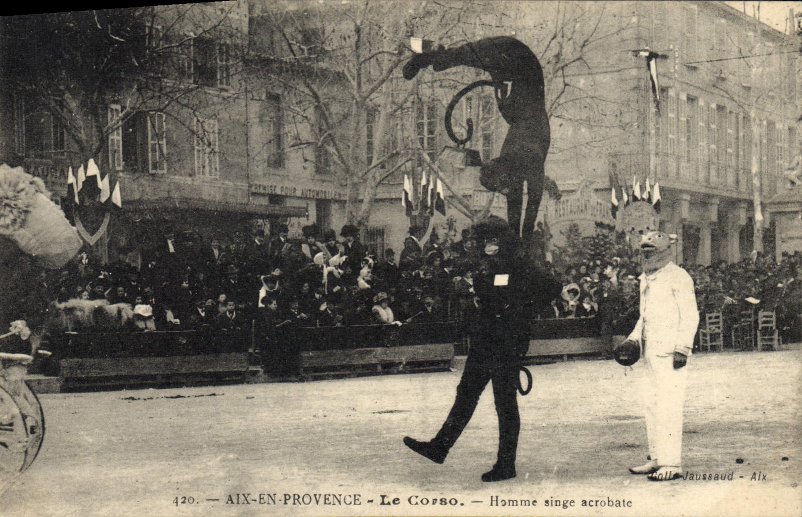 Aix de la feria de diversión de la POSTAL de la VENDIMIA en acróbata del mono del hombre de Provence Corso