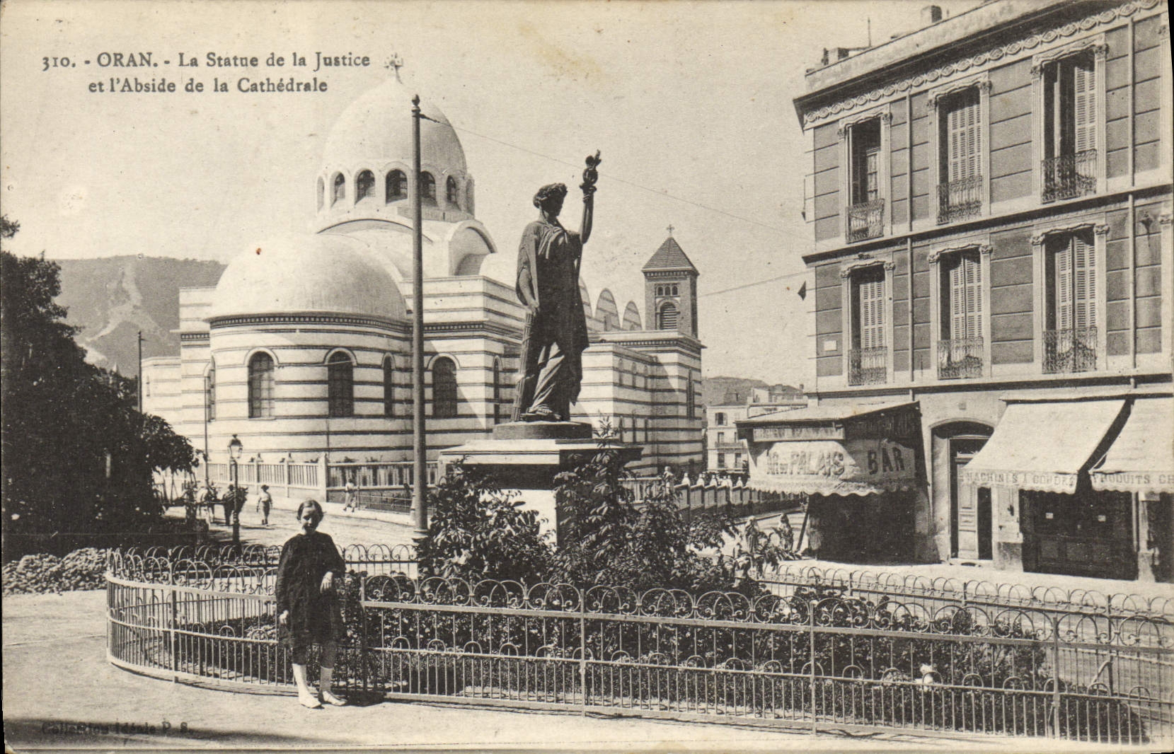 VINTAGE POSTCARD Statue of the freedom and the apse of the cathedral Oran Algeria