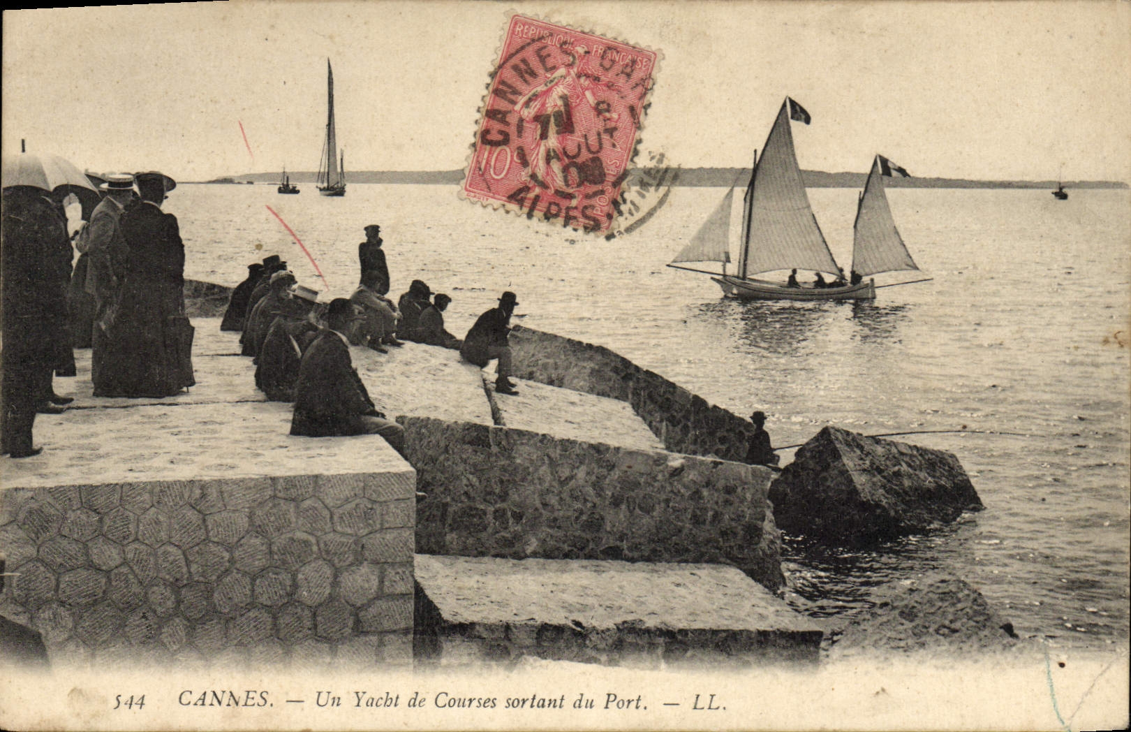 VINTAGE POSTCARD Bateau Fishes Cannes a Racing yacht leaving the port