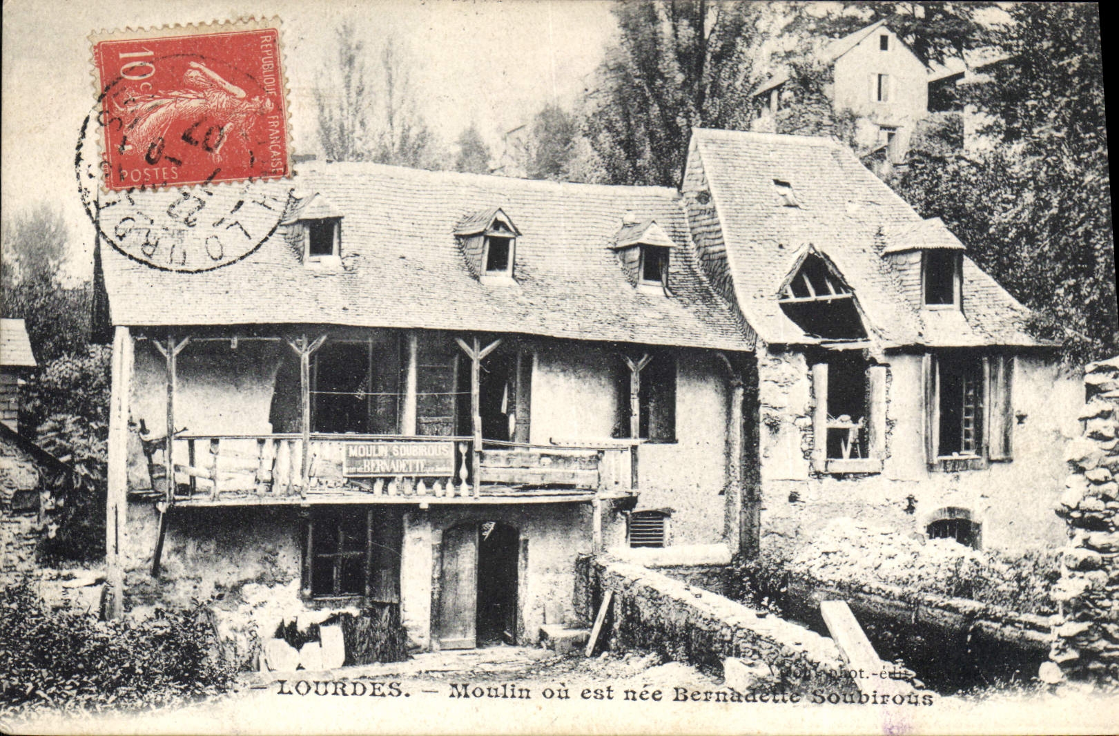 VINTAGE POSTCARD Mill Heavy Mill or is Bernadette Soubirous