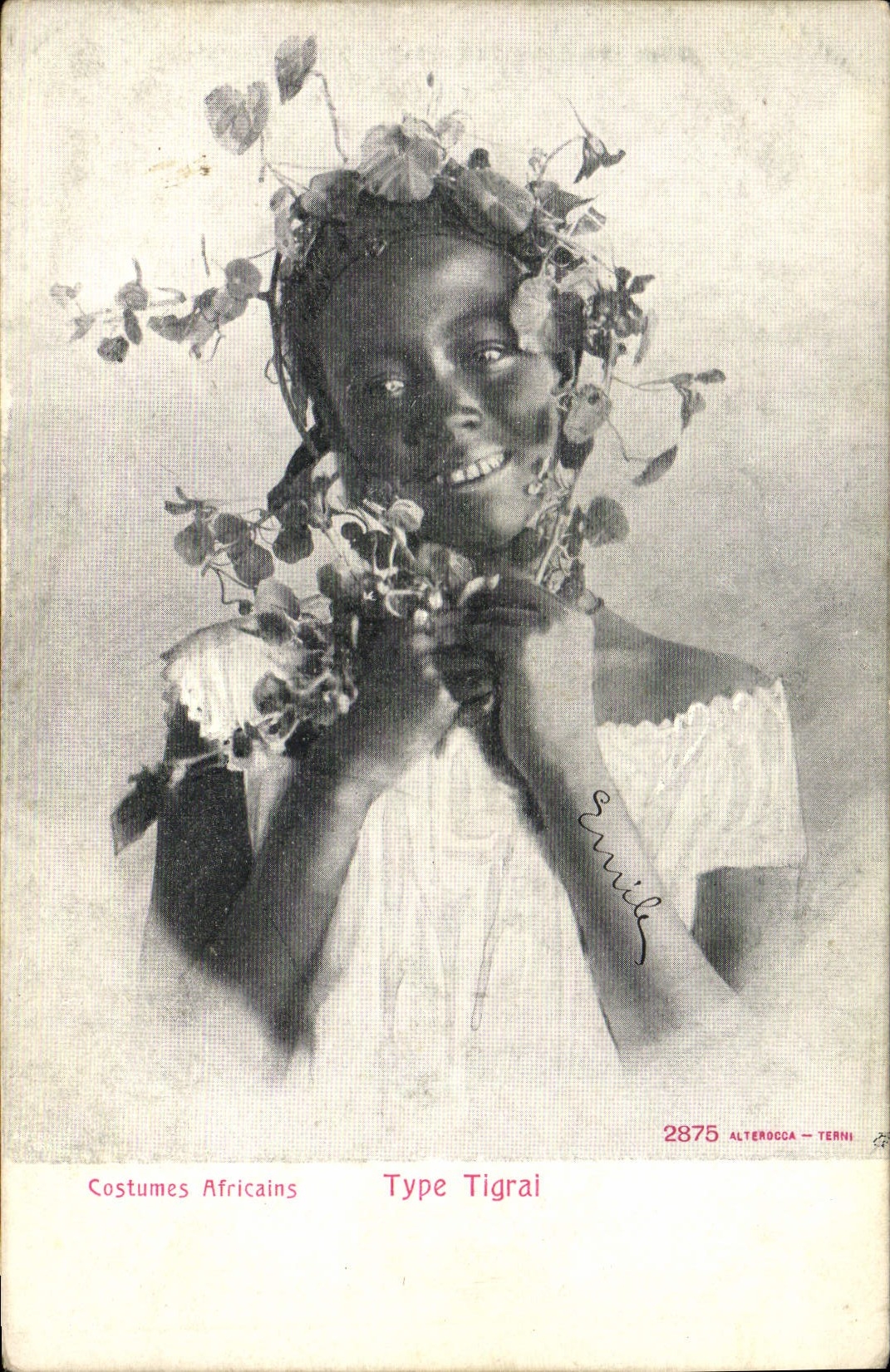 El africano de la POSTAL de la VENDIMIA viste el tipo de Tigrai del negro