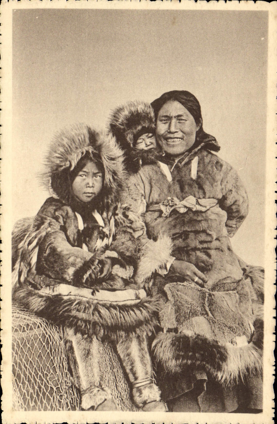 VINTAGE POSTCARD Polar Alasak a Christian woman of the Arctic Ocean and her two children
