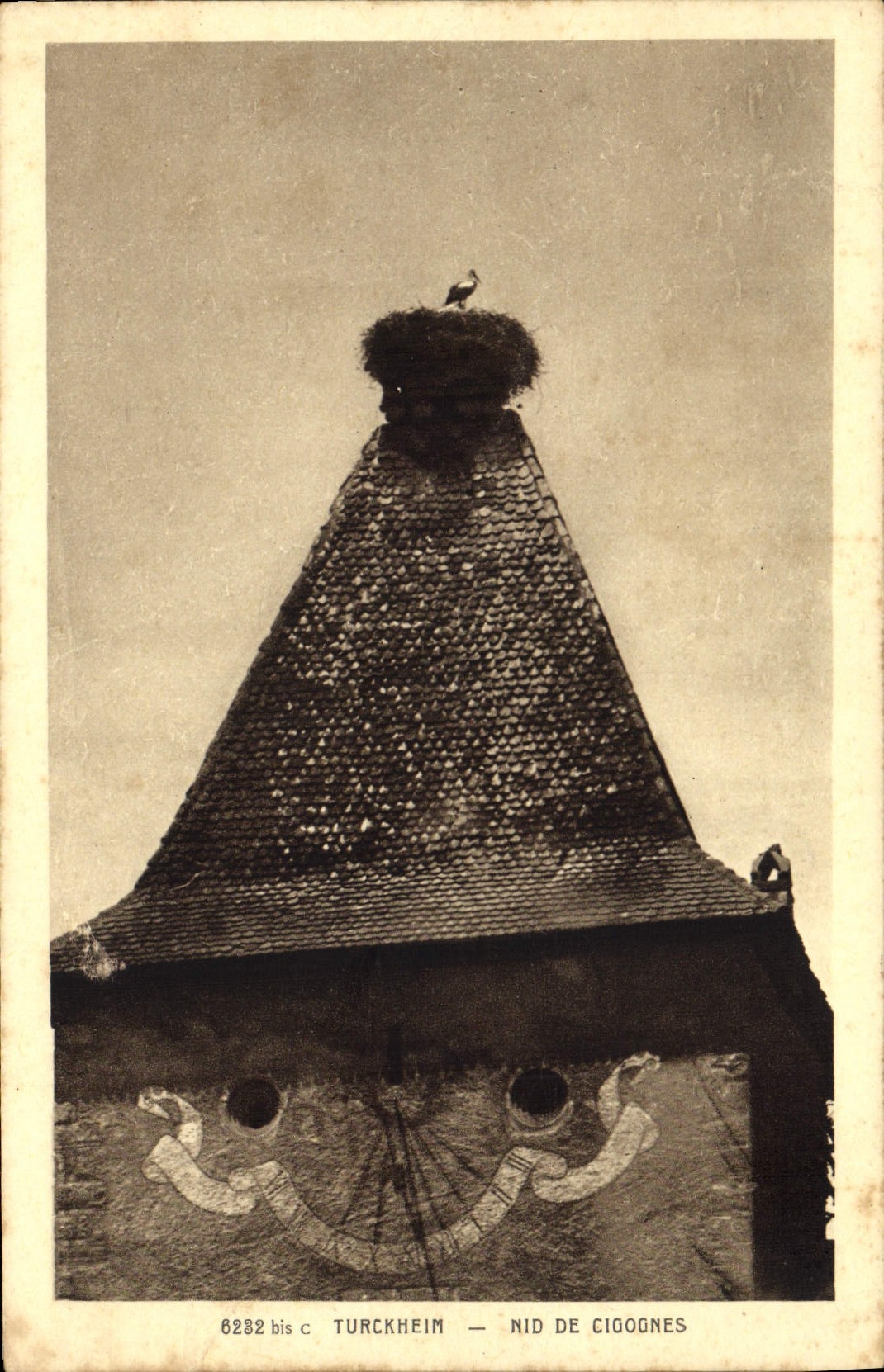 Postal Reloj Turckheim Nido de cigüeñas