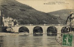 CPA L'Aveyron Pittoresque St Geniez d'Olt Le Pont sur le Lot 