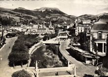 CPSM La Bourboule Puy de Dome la Dordogne dans sa traversee de la ville Au fond le Puy Gros 