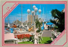 CPSM La Grande Motte La Ville de l'An 2000 Un coin du Port de plaisance a l'arriere plan la Grande P
