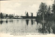 CPA Abbaye de La Grande Trappe l'Abbaye vue de l'Etang Soligny la Trappe Orne 