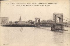 CPA Le Pont suspendu sur le Rhone reliant Tarascon a Beaucaire le Chateau du Roi Rene et le clocher 