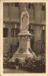CPA La Statue de Sainte Therese de l'Enfant Jesus dans la cour d'entree du Carmel de Lisieux 