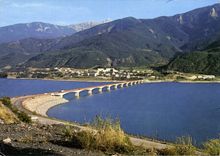 CPM Savines Le Lac Hautes Alpes Le Pont sur le lac de Serre Poncon et le village  