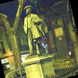 CPM Arles Bouches du rhone place du Forum la statue de Mistral par Th Riviere entouree d'une grille 