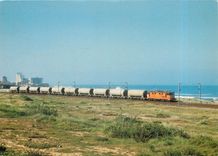 CPM Near Espinhti a 2500s class electric at speed with a train of cement wagons 