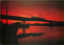 CPM Train on the docks crossing at sunset