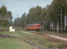 CPM Class dmu passes the small halt at Tjunnaryd on the Nassjo nydro line