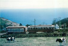 CPM Manx Electric railway train passing through typical scenery at Burn's Crossing