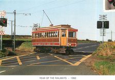 CPM Manx Electric railway tram crossing Onchan on Sunday